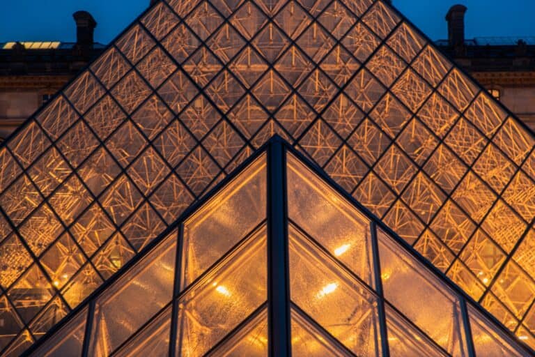Closeup detail view from Louvre Pyramid during twilight with amazin illumination.